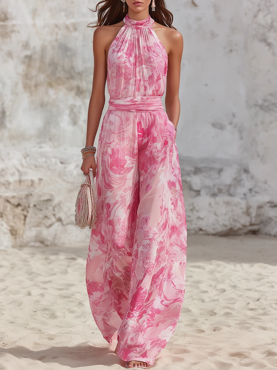 Mono de gasa con estampado floral rosa, cuello halter y pernera ancha