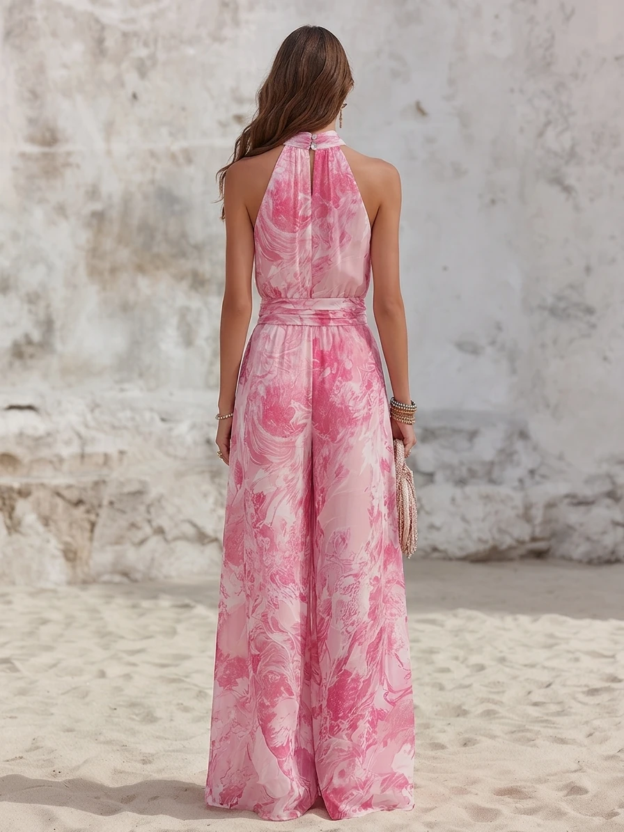 Mono de gasa con estampado floral rosa, cuello halter y pernera ancha