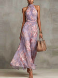 Vestido largo de tirantes al cuello en gasa con estampado floral rosa